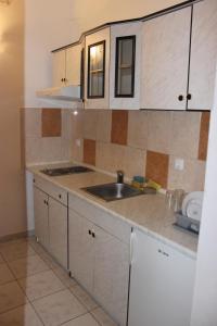 a kitchen with a sink and a counter top at Apartments with a parking space Gradac, Makarska - 15628 in Gradac
