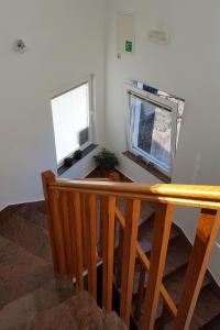 a staircase with a table and a window in a room at Studio Gradac 15642b in Gradac
