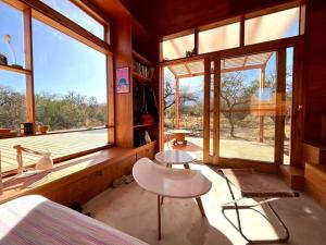 Posezení v ubytování Mandala Tiny House, Traslasierra.