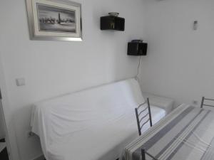 a bedroom with a bed and a picture on the wall at Apartments with a swimming pool Sevid, Trogir - 15664 in Sevid