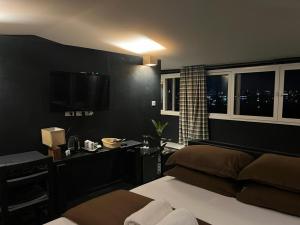 Ένα ή περισσότερα κρεβάτια σε δωμάτιο στο Gusto Accommodation