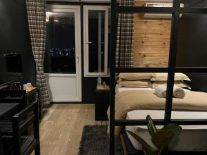 Ένα ή περισσότερα κρεβάτια σε δωμάτιο στο Gusto Accommodation