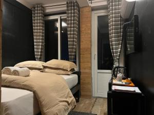 Ένα ή περισσότερα κρεβάτια σε δωμάτιο στο Gusto Accommodation