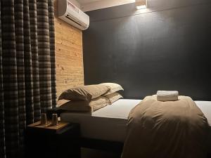 Ένα ή περισσότερα κρεβάτια σε δωμάτιο στο Gusto Accommodation
