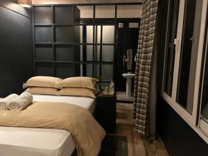 Ένα ή περισσότερα κρεβάτια σε δωμάτιο στο Gusto Accommodation