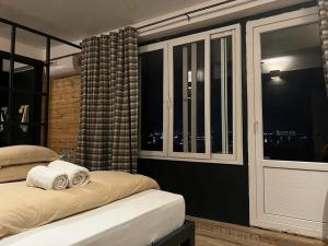 Ένα ή περισσότερα κρεβάτια σε δωμάτιο στο Gusto Accommodation