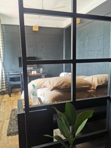 Ένα ή περισσότερα κρεβάτια σε δωμάτιο στο Gusto Accommodation