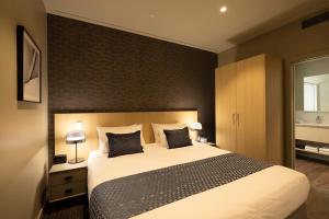 Cama ou camas em um quarto em Quest 256 Lambton