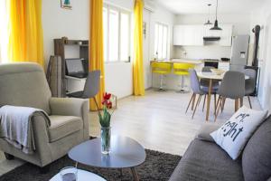 a living room with a couch and a table at Apartments with parking space Trpanj, Peljesac - 15710 in Trpanj
