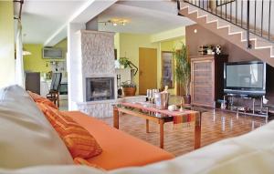 a living room with a couch and a fireplace at Family friendly house with a swimming pool Posedarje, Novigrad - 15785 in Islam Latinski