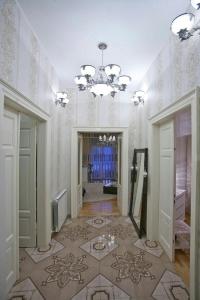 a large room with a chandelier and a tile floor at Apartments with WiFi Pula - 15986 in Pula