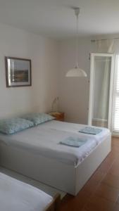 Fotografia z galérie ubytovania Apartments by the sea Tucepi, Makarska - 16037 v Tučepi