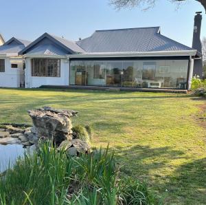 a house with a large yard with a rock at Bourne View in Nottingham Road