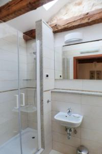 a bathroom with a sink and a shower at Holiday house with a parking space Skrbcici, Krk - 16084 in Vrh