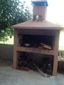 a outdoor brick oven with a fire inside of it at Studio Pag 16100a in Pag