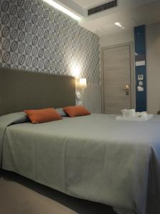 
a hotel room with a bed and a television at Ca' D'Andrean in Manarola
