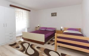 Posteľ alebo postele v izbe v ubytovaní Apartments with a parking space Omis - 16185