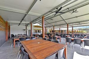 a large room with tables and chairs in it at Ironbark Hill Estate in Pokolbin
