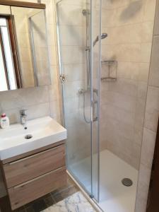 a bathroom with a shower and a sink at Apartments by the sea Cove Mulobedanj, Pag - 16285 in Lun