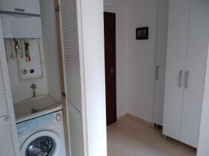 a laundry room with a washing machine in a room at Apartments with a parking space Krapinske Toplice, Zagorje - 16290 in Krapinske Toplice