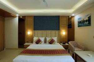 Katil atau katil-katil dalam bilik di Hotel Sakura by Maps