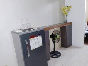 a counter in a room with a fan at Affordable Transient along Ortigas Ext in Cainta