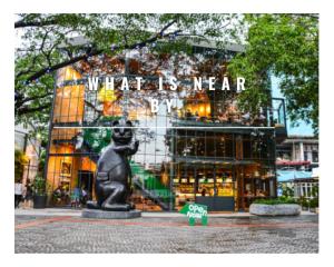 a building with a statue in front of it at Like A Local in Chiang Mai