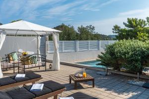 a patio with a gazebo and a swimming pool at Seaside house with a swimming pool Pasadur, Lastovo - 15847 in Lastovo