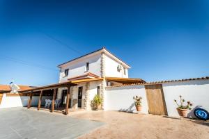 a house with a large patio in front of it at Reel Paradise Villa, Cyprus in Larnaca