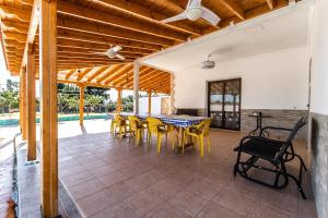 a dining room with a table and chairs at Reel Paradise Villa, Cyprus in Larnaca
