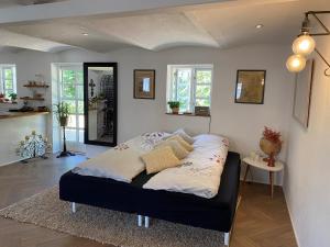 Ένα ή περισσότερα κρεβάτια σε δωμάτιο στο Guldforhoved B&B