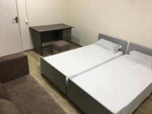 Postel nebo postele na pokoji v ubytování Bonvenon capsule Hostel
