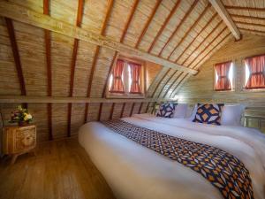 Tempat tidur dalam kamar di Wisnu Lumbung Uluwatu