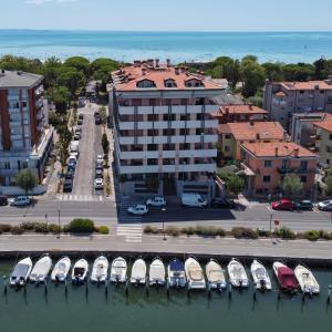 an aerial view of a marina with boats in the water at Aparthotel Capitol in Grado