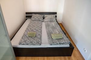 Posteľ alebo postele v izbe v ubytovaní Darling Apartman