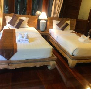 A bed or beds in a room at Anda Resort Koh Lipe