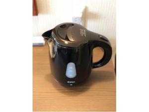 a black tea kettle sitting on top of a table at Grand Plaza Nakatsu Hotel - Vacation STAY 28286v in Nakatsu