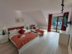 Postel nebo postele na pokoji v ubytování Paula Wellness & SPA