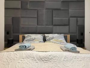 מיטה או מיטות בחדר ב-Apartmán Nelka v Poprade