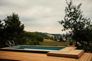 a swimming pool on the deck of a house at Ca' San Michele in Asti