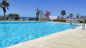Bazén v ubytování Dunas Beach Apartment nebo v jeho okolí