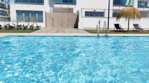 Bazén v ubytování Dunas Beach Apartment nebo v jeho okolí