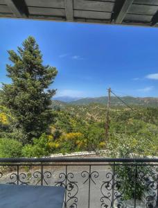 a view of the mountains from a balcony at Xenonas Vasilikou in Valtessiniko