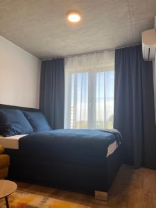 Postel nebo postele na pokoji v ubytování Pražská Apartments