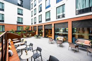 a patio with tables and chairs on a building at Staycity Aparthotels Dublin City Centre in Dublin