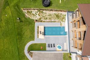 an overhead view of a building with a swimming pool at Hotel Tyrol in Valle Di Casies