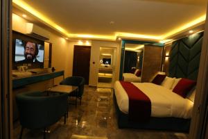 a hotel room with a bed and a bathroom at Petra Sella Hotel in Wadi Musa