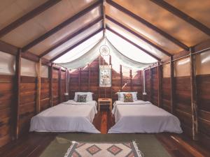 Letto o letti in una camera di THE RIVER RUNS CHIANG KLANG