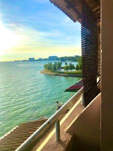 a view of the ocean from the balcony of a building at PD VIP SEAVIEW w Wifi n Smart TV in Port Dickson