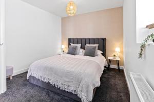 a bedroom with a large bed in a room at The Snug at The Hideaway STAMP SA in Blackpool
